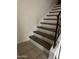 Staircase with wood treads and white risers at 1342 W Emerald Ave # 373, Mesa, AZ 85202