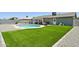 Spacious backyard featuring a well-maintained lawn, a pool area and space for gardening and outdoor activities at 13842 N 40Th Ave, Phoenix, AZ 85053