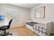 This bedroom features a comfortable bed, desk, and natural light for a serene atmosphere at 13842 N 40Th Ave, Phoenix, AZ 85053