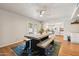 Charming dining area with view to kitchen, stylish table, and lots of natural light at 13842 N 40Th Ave, Phoenix, AZ 85053