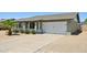 Charming single-story home with a well-maintained front yard and a two-car garage at 13842 N 40Th Ave, Phoenix, AZ 85053