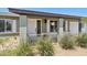Inviting front entrance with a white door, decorative shutters, and lush greenery adds curb appeal at 13842 N 40Th Ave, Phoenix, AZ 85053