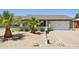 Charming single-story home showcasing desert landscaping, a well-manicured yard, and a two-car garage at 13842 N 40Th Ave, Phoenix, AZ 85053