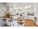 Bright kitchen with modern appliances, white cabinetry, and a convenient breakfast bar at 13842 N 40Th Ave, Phoenix, AZ 85053