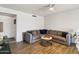 Comfortable living room featuring stylish decor, tile floors, and a modern ceiling fan at 13842 N 40Th Ave, Phoenix, AZ 85053