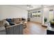 Inviting living room with a large window, stylish decor, and comfortable seating at 13842 N 40Th Ave, Phoenix, AZ 85053