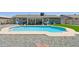 Backyard featuring a sparkling swimming pool, covered patio, and well-kept landscaping at 13842 N 40Th Ave, Phoenix, AZ 85053