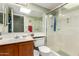 Clean and well-maintained bathroom featuring a single sink vanity and a glass-enclosed shower at 14428 W Moccasin Trl, Surprise, AZ 85374