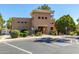 Community center featuring desert landscaping, ample parking, and a welcoming entrance at 14428 W Moccasin Trl, Surprise, AZ 85374