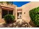 Inviting front entrance with desert landscaping and gated courtyard at 14428 W Moccasin Trl, Surprise, AZ 85374