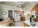 Bright kitchen with white appliances, tiled floors, and a cozy breakfast nook at 14428 W Moccasin Trl, Surprise, AZ 85374