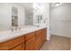 Bathroom features a double sink vanity with plentiful lighting and linen closet access at 14815 N Fountain Hills Blvd # 201, Fountain Hills, AZ 85268
