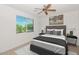 Bright bedroom features a large window and neutral decor, perfect for relaxation and personalization at 14815 N Fountain Hills Blvd # 201, Fountain Hills, AZ 85268