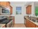 Efficient kitchen featuring stainless steel appliances, a double sink, and tile flooring at 14815 N Fountain Hills Blvd # 201, Fountain Hills, AZ 85268