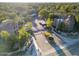 Community aerial view showcasing lush landscaping, a gated entrance, ample parking, and an array of palm trees at 15252 N 100Th St # 1164, Scottsdale, AZ 85260
