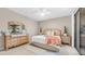 Cozy bedroom featuring ceiling fan, sliding doors to the yard, and a lovely furniture set at 15252 N 100Th St # 1164, Scottsdale, AZ 85260