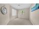 Bright bedroom featuring a large window and neutral carpeting at 15252 N 100Th St # 1164, Scottsdale, AZ 85260
