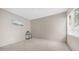 A bright bedroom with neutral carpet and large window at 15252 N 100Th St # 1164, Scottsdale, AZ 85260