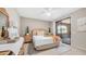Calm bedroom with slider to the backyard, ceiling fan and wooden furniture set at 15252 N 100Th St # 1164, Scottsdale, AZ 85260