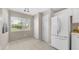 Bright eat-in kitchen with white appliances and tile flooring at 15252 N 100Th St # 1164, Scottsdale, AZ 85260