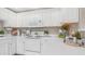 Clean white kitchen with modern appliances and stylish decor at 15252 N 100Th St # 1164, Scottsdale, AZ 85260