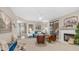 Bright living room with fireplace, blue sofa, and stylish decor at 15252 N 100Th St # 1164, Scottsdale, AZ 85260