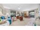 Open-concept living room with fireplace, dining area, and sliding glass doors for lots of light at 15252 N 100Th St # 1164, Scottsdale, AZ 85260