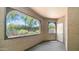Enclosed patio with decorative windows and lush greenery views at 15252 N 100Th St # 1164, Scottsdale, AZ 85260