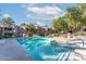 Inviting community pool featuring a relaxing jacuzzi, lounge chairs, and shady umbrellas for ultimate enjoyment at 15252 N 100Th St # 1164, Scottsdale, AZ 85260