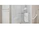 Accessible shower featuring glass enclosure, seat, grab bars, and sleek fixtures at 15252 N 100Th St # 1164, Scottsdale, AZ 85260
