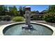 Attractive water fountain surrounded by manicured landscaping and lush trees at community at 15252 N 100Th St # 1164, Scottsdale, AZ 85260