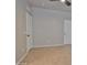 Bedroom features neutral paint, tile floors, ceiling fan and two white doors at 15354 W Caribbean Ln, Surprise, AZ 85379