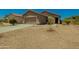Charming single-Gathering home featuring desert landscaping, inviting entrance and well-maintained exterior at 15354 W Caribbean Ln, Surprise, AZ 85379