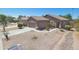 Charming single story home featuring a two-car garage, desert landscaping, and a walkway to the front door at 15354 W Caribbean Ln, Surprise, AZ 85379