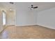 Open living room boasts tile floors, plenty of natural light, and neutral paint offering a versatile space at 15354 W Caribbean Ln, Surprise, AZ 85379