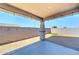 Spacious covered patio with concrete flooring, string lights, and a view of the backyard at 16389 N 180Th Dr, Surprise, AZ 85388