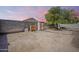 Spacious backyard with storage shed and ample room for recreation or gardening at 16523 W Desert Bloom St, Goodyear, AZ 85338
