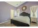 Spacious bedroom with vaulted ceilings, neutral walls, wood floors, and ample natural light at 16523 W Desert Bloom St, Goodyear, AZ 85338