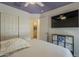 Bright bedroom features a neutral colored ceiling and walls, perfect for a relaxing sleep at 16523 W Desert Bloom St, Goodyear, AZ 85338