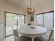 Bright dining room with large window and sliding glass door leading to the backyard at 16523 W Desert Bloom St, Goodyear, AZ 85338