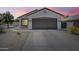 Charming single-story home featuring a two-car garage and low-maintenance desert landscaping at 16523 W Desert Bloom St, Goodyear, AZ 85338