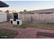 Outdoor brick barbeque and block wall on a lot with partial brick and grass at 18045 N 20Th N Ln, Phoenix, AZ 85023