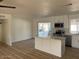 Bright kitchen with island, stainless appliances, and sliding glass door leading to the backyard at 18045 N 20Th N Ln, Phoenix, AZ 85023