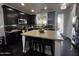 Stylish kitchen with dark wood cabinets, an island with seating, and stainless steel appliances at 1812 S Racine Ln, Gilbert, AZ 85295