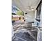 Covered patio with a ceiling fan and outdoor seating area in a backyard retreat at 1812 S Racine Ln, Gilbert, AZ 85295