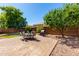Spacious backyard featuring a large paver patio and mature landscaping at 2053 E Saddlebrook Ct, Gilbert, AZ 85298