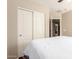 Bright bedroom with a closet, ceiling fan and access to the ensuite bathroom at 2053 E Saddlebrook Ct, Gilbert, AZ 85298