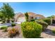 Charming single-story home featuring a well-manicured front yard with mature landscaping at 2053 E Saddlebrook Ct, Gilbert, AZ 85298