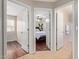 Inviting hallway showcasing three doorways leading to a bedroom, bathroom and another bedroom at 2053 E Saddlebrook Ct, Gilbert, AZ 85298