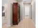 Hallway with tile flooring leading to an arched display cabinet and entry way at 2053 E Saddlebrook Ct, Gilbert, AZ 85298